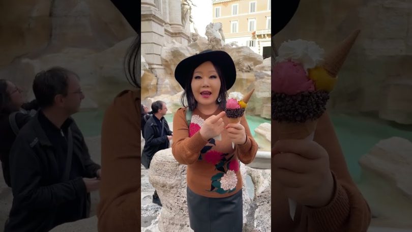 Eating gelato in front of Trevi Fountain in Rome, Italy!